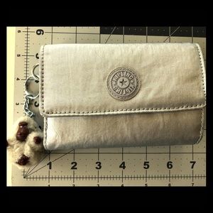 Silver Kipling wallet with monkey